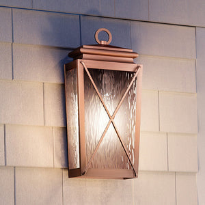 An UHP1410 Vintage Outdoor Wall Sconce 17.875''H x 8''W lighting fixture from the Buffalo Collection by Urban Ambiance on the side of a house.