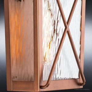 A unique UHP1410 Vintage Outdoor Wall Sconce 17.875''H x 8''W, with an antique copper finish and a beautiful glass shade made by Urban Ambiance.