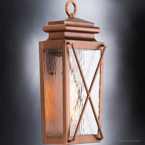 A beautiful outdoor light fixture with a glass shade.