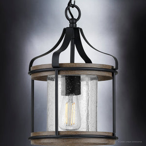 A Unique UHP1420 Farmhouse Outdoor Pendant 15''H x 10''W with a clear glass shade.
