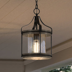 A unique UHP1420 Farmhouse Outdoor Pendant 15''H x 10''W, Midnight Black Finish, Gilbert Collection lamp hanging over a porch, made by Urban Ambiance.
