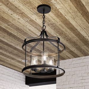 A unique UHP1421 Farmhouse Outdoor Pendant hanging from a brick wall.