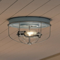 An Urban Ambiance UHP1431 Farmhouse Outdoor Ceiling Light 7.875''H x 14.5''W, Gray Blue Finish, Kenner Collection with a metal cage and a