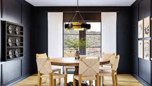 A dining room featuring a gorgeous lighting fixture - the UHP3860 Contemporary Chandelier 23.75''H x 31.75''W, Midnight Black Finish, Gambier Collection by Urban