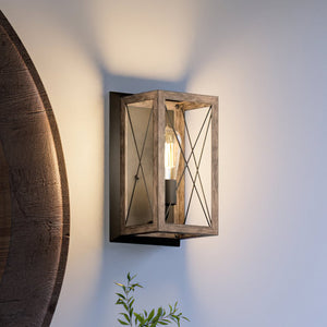 An UHP3910 Industrial Wall Sconce with a unique wooden frame made by Urban Ambiance.