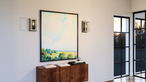 A beautiful UHP3911 Industrial Wall Sconce with a Charcoal Finish from Urban Ambiance hangs on a wall in a living room.