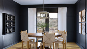 An Urban Ambiance dining room with a unique UHP3912 Industrial Chandelier.