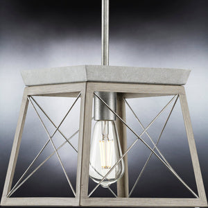 A luxury pendant light fixture with a unique metal frame and glass bulb by Urban Ambiance.