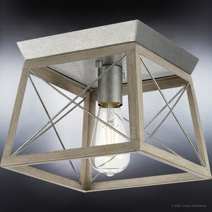 A gorgeous UHP3916 Industrial Ceiling Light 7.625''H x 9.5''W, Galvanized Steel Finish from Urban Ambiance, with a metal frame and a light bulb