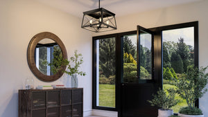 A black and white entryway with a UHP3919 Industrial Chandelier 12''H x 20''W, Midnight Black Finish from the Berkeley Collection, manufactured by Urban Ambiance.