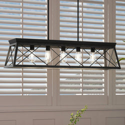 A luxurious UHP3920 Industrial Chandelier with a gorgeous Midnight Black Finish from the Berkeley Collection by Urban Ambiance elegantly hangs over a window with shutters.