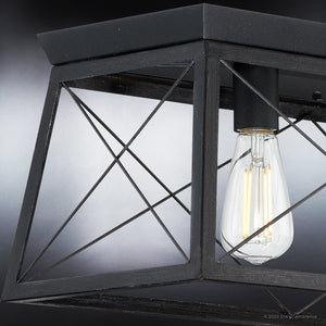 An Urban Ambiance UHP3920 Industrial Chandelier 9''H x 38''W, Midnight Black Finish, Berkeley Collection ceiling light fixture with a lamp in it.