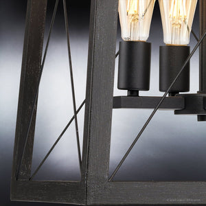 Three unique UHP3921 Industrial Chandeliers with a gorgeous Midnight Black Finish, hanging from a metal frame by Urban Ambiance.