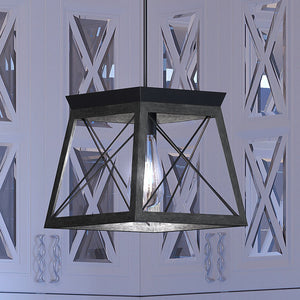 A unique and luxurious UHP3922 Industrial Pendant 9''H x 10''W, Midnight Black Finish, Berkeley Collection lighting fixture hangs from the ceiling in a room.