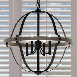 An Urban Ambiance UHP3931 Farmhouse Chandelier, a luxury lighting fixture, hanging over a window with blinds.