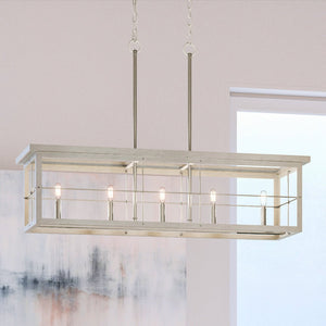 Luxury UHP3950 Modern Farmhouse Chandelier, a gorgeous lighting fixture, hanging over a dining room table.