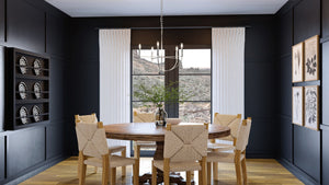 A dining room with black walls and a unique UHP3971 Modern Farmhouse Chandelier 20''H x 22.375''W, Brushed Nickel Finish, Armidale