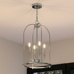 A unique lighting fixture, the Urban Ambiance UHP3973 Modern Farmhouse Chandelier, with a brushed nickel finish, is hanging over a window in a room.
