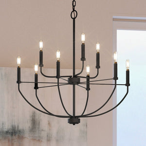 A beautiful UHP3975 Modern Farmhouse Chandelier with a Midnight Black Finish, hanging in a living room.