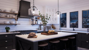 A unique Urban Ambiance black and white kitchen with a center island and beautiful lighting fixture.