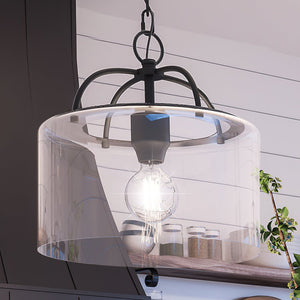 An UHP3977 Modern Farmhouse Pendant 13''H x 13''W, Midnight Black Finish, Armidale Collection lighting fixture hanging over a kitchen counter.