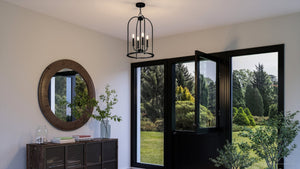 A hallway with a UHP3978 Modern Farmhouse Chandelier 23''H x 15''W, Midnight Black Finish, Armidale Collection pendant light by Urban Ambiance.