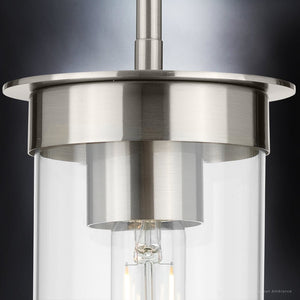 A beautiful UHP3983 New Traditional Pendant 8.875''H x 5''W, Brushed Nickel Finish light fixture with a clear glass shade by Urban Ambiance.