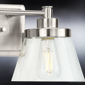 A beautiful UHP3990 Traditional Bath Light 7.75''H x 15.5''W, Brushed Nickel Finish, Pawtucket Collection bathroom light fixture with a clear glass shade