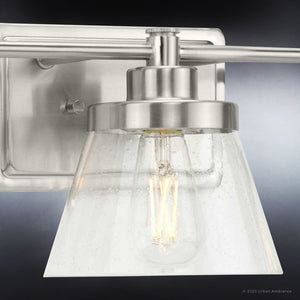 An Urban Ambiance UHP3991 Traditional Bath Light 7.75''H x 24.5''W, Brushed Nickel Finish, Pawtucket Collection bathroom light fixture with a clear