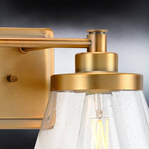 A luxury bathroom lighting fixture with a clear glass shade.