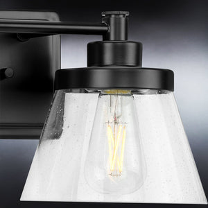 A unique Urban Ambiance UHP3996 Traditional Bath Light with a clear glass shade.