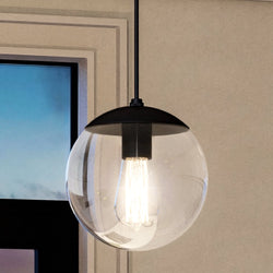 A beautiful UHP4012 Minimalist 8.75''H x 8''W pendant lamp with a Midnight Black Finish, Canton Collection hanging light in a room with a window.