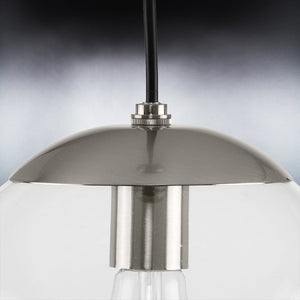 A beautiful pendant light with a glass globe and a metal base.