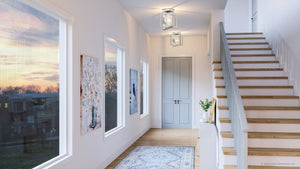 An image of a hallway with stairs and a rug featuring the beautiful UHP4019 Minimalist Ceiling Light from the Canton Collection by Urban Ambiance.
