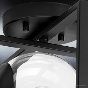 A black UHP4021 Minimalist Ceiling Light 9.75''H x 12''W, Midnight Black Finish, Singleton Collection with a glass globe by Urban Ambiance, providing