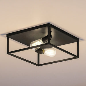 An UHP4032 Modern Ceiling Light 4.5''H x 12''W, Midnight Black Finish, Singleton Collection by Urban Ambiance - a beautiful lighting fixture with two bulbs.