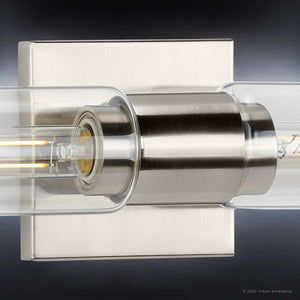 A beautiful UHP4050 Cosmopolitan Bath Light 5''H x 20.375''W, Brushed Nickel Finish, Tustin Collection with a glass bulb.