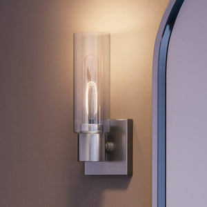 A UHP4054 Cosmopolitan Wall Sconce with a glass bulb, creating a luxurious and gorgeous ambiance.