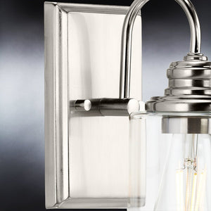 A gorgeous UHP4060 Vintage Wall Sconce 9.875''H x 4.5''W lighting fixture, with a brushed nickel finish and clear glass bulb from the Hedland
