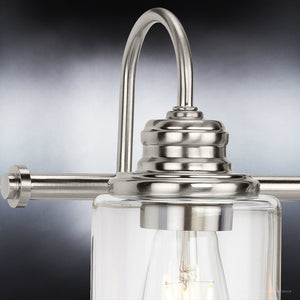 A beautiful Urban Ambiance UHP4062 Vintage Bath Light 9.875''H x 23.375''W, Brushed Nickel Finish, Hedland Collection with a clear glass