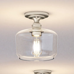 A unique Urban Ambiance UHP4064 Vintage Ceiling Light with a glass shade and a metal frame.
