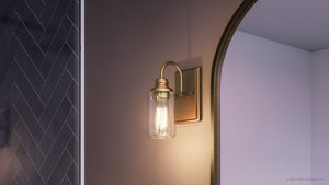 A unique wall sconce with a light bulb in it, from the Urban Ambiance brand.
