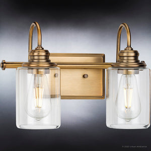 An UHP4066 Vintage Bath Light 9.875''H x 14.625''W, Olde Brass Finish, Hedland Collection by Urban Ambiance with two clear glass bulbs,