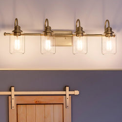 A beautiful bathroom with a UHP4068 Vintage Bath Light and a unique barn door.