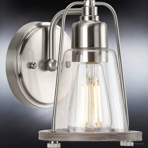 A unique and luxurious UHP4070 Coastal Wall Sconce with a clear glass bulb, from the Kempsey Collection and branded by Urban Ambiance.