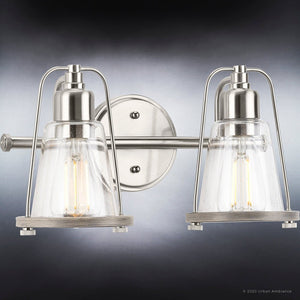 Luxury coastal bath light fixtures with unique clear glass shades on a dark background.