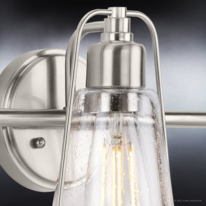A Gorgeous Urban Ambiance Coastal Bath Light featuring a Brushed Nickel Finish and Clear Glass Bulb.