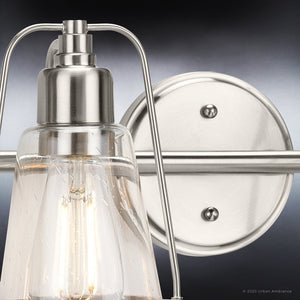 An Urban Ambiance unique lighting fixture with a UHP4073 Coastal Bath Light 8.25''H x 33''W, Brushed Nickel Finish, Kempsey Collection clear glass bulb.