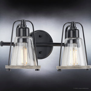 Two beautiful UHP4075 Coastal Bath Lights with glass shades on a black background.