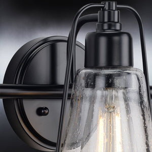 A beautiful Urban Ambiance bathroom light fixture with a clear glass shade.